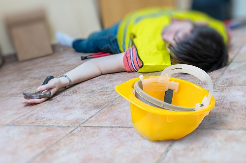Worker had an accident and is lying injured on the floor - hero image for Workplace Accidents, Reporting Procedure blog