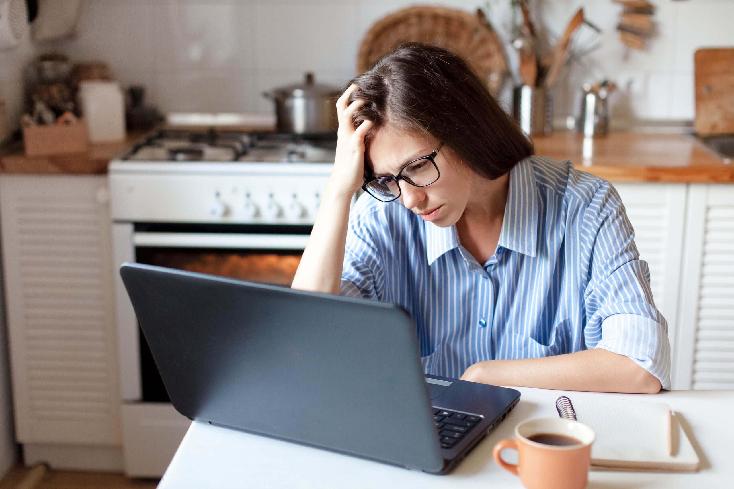 Upset woman working from home office as hero image for article about mental Health Awareness Week 2023